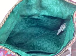 mala al&ccedil;a comprida desigual