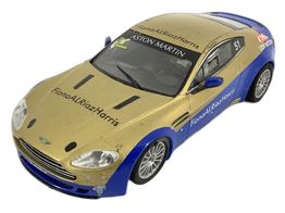 coche slot scalextric aston martin vantage dorado y azul