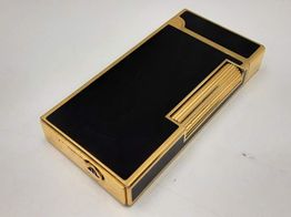 encendedor maurice lacroix dorado y negro