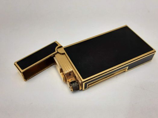 encendedor maurice lacroix dorado y negro