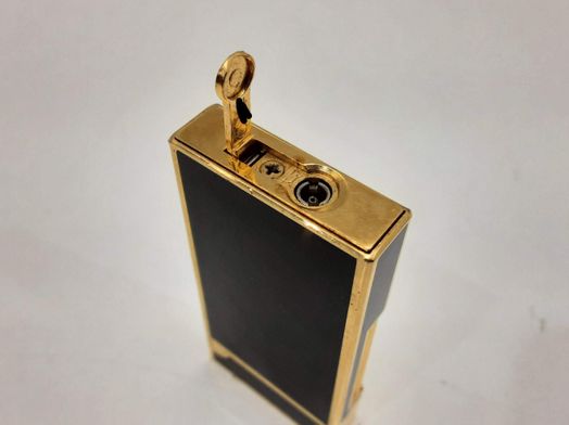 encendedor maurice lacroix dorado y negro