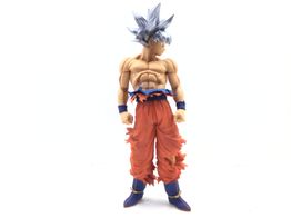 figura accion bandai son goku ultra instinto