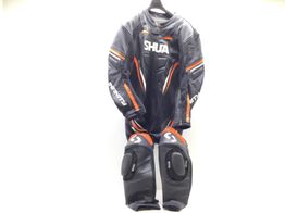 traje mono shua infinity negro naranja